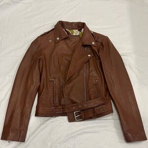 Brown leather jacket with floral lining.